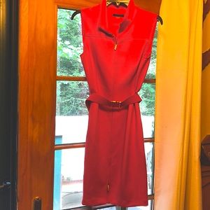 Coral sleeveless collared dress. Gold zipper and matching gold buckle.